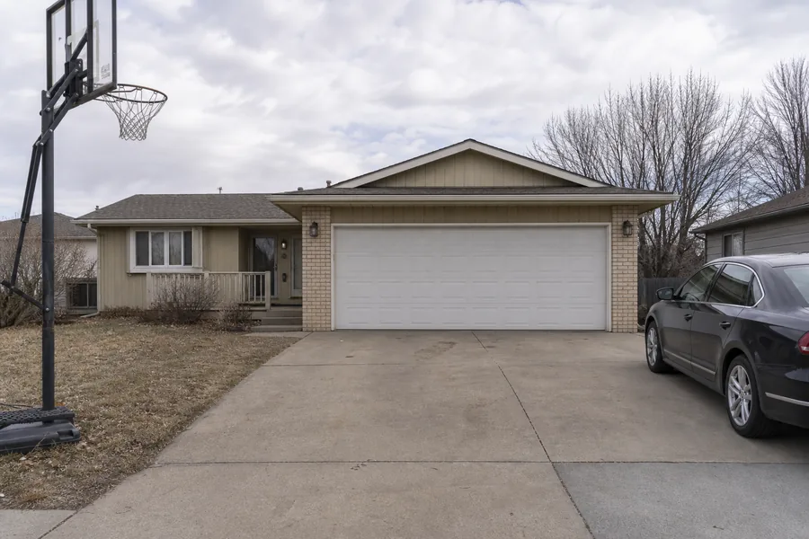 A house with an attached garage in Topeka, KS