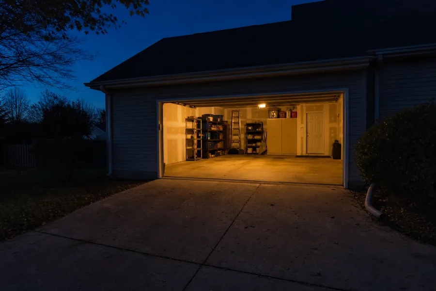 Two-car garage on a newer home at dusk