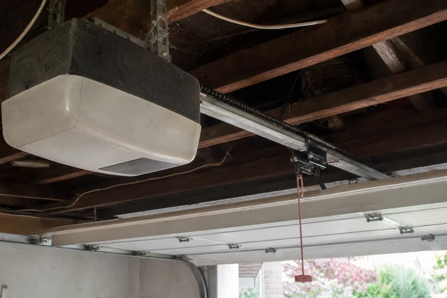 Opener rail above a door hanging out of its track