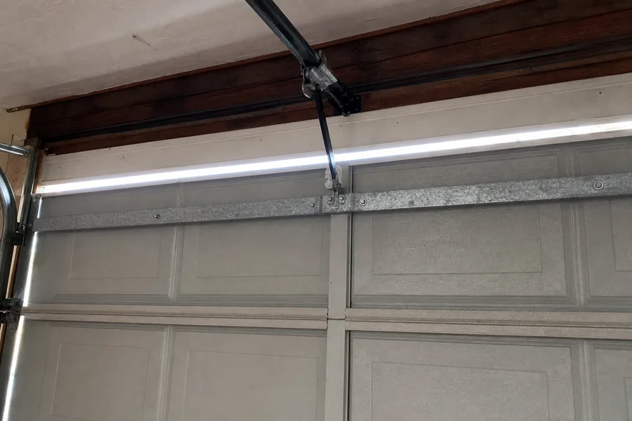 Reinforcement strut across the top panel of a double garage door in Topeka, KS